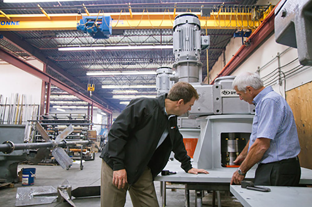 Inspecting Pedestal Mount on Industrial Mixer